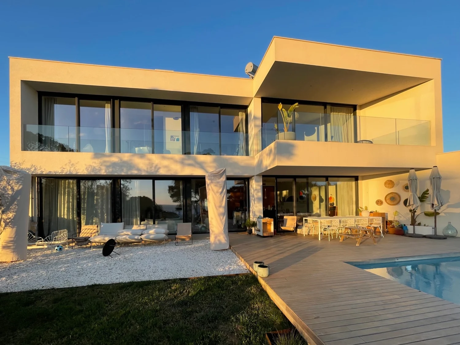Mallorca · a home at golden hour — A furnished home and its outdoor living spaces. Actual photograph from Hanno Strack’s earlier portfolio.
